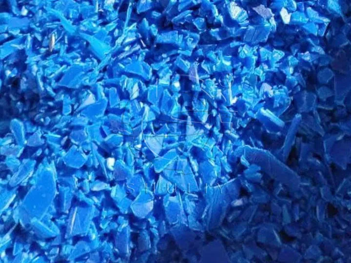 Pieces of crushed plastic drums